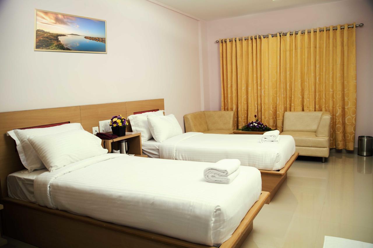 Hotel Rainbow Suites Kannur Bagian luar foto